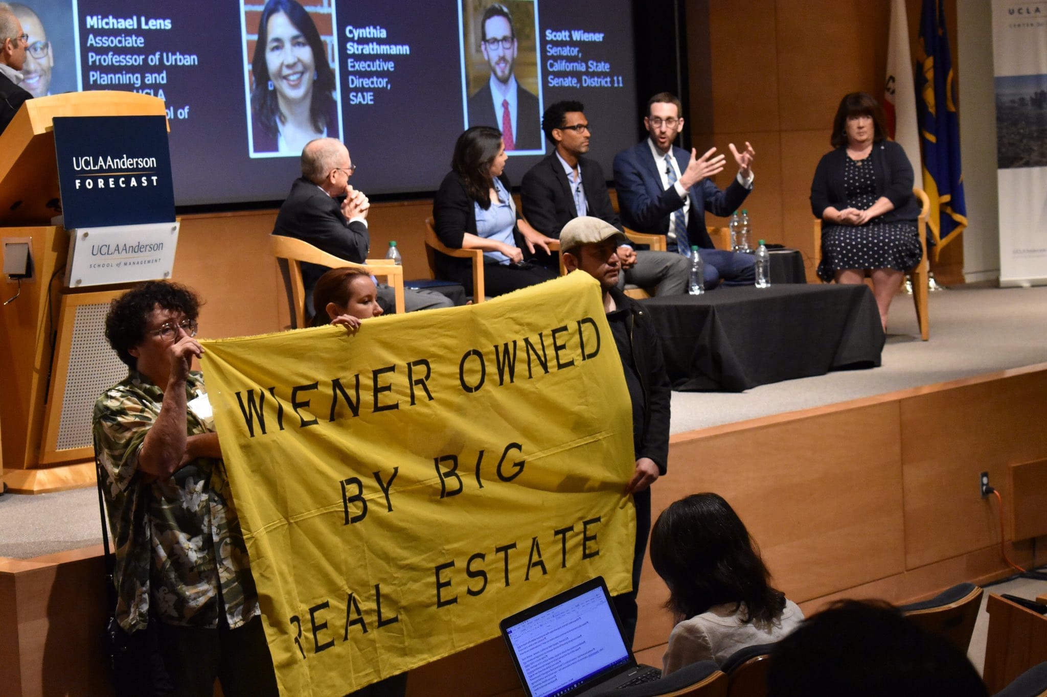 Featured image for “Housing Activists Disrupt State Senator Scott Wiener’s Appearance at UCLA Anderson Economic Outlook”